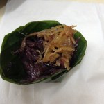 roasted coconut & sticky rice inside a banana leaf